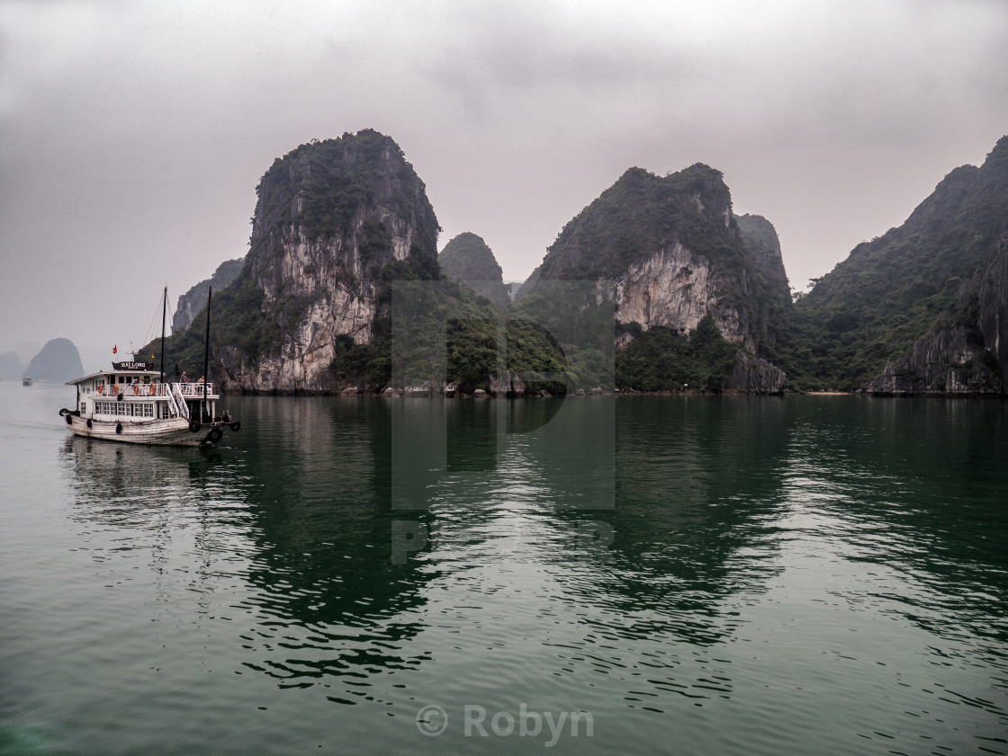 Boat in Misty Halong Bay Rock Islands, Vietnam License, download or